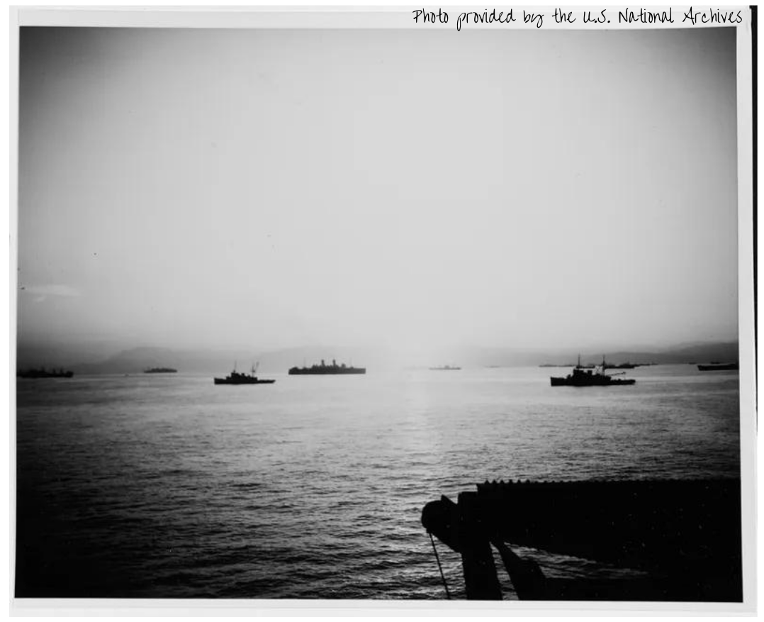 Sunrise over Salerno Bay, 10 September 1943, showing a portion of the invasion fleet. Two U.S. Navy fleet tugs are among the nearer ships.