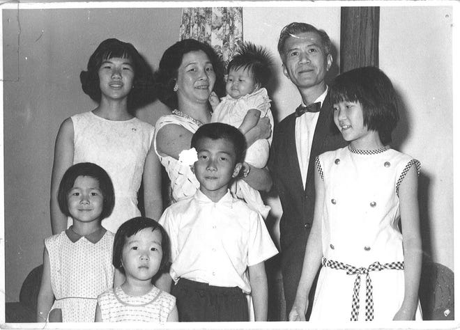 The Chin family in 1965 in Minneapolis: Back row from left, Linda, Leeann holding Katie and Tony.  First row from left, Laura, Jeanie, Bill and Patty.