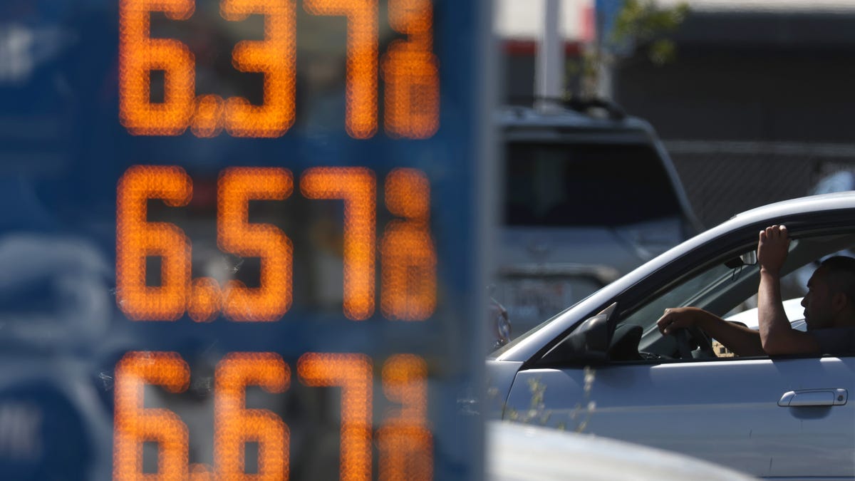 A driver passes a sign with gas prices over $6.00 per gallon on May 20, 2022 in San Rafael, California.