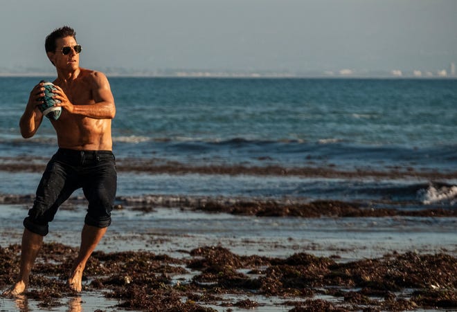 Tom Cruise has still got it, throwing a pass in dogfight football.