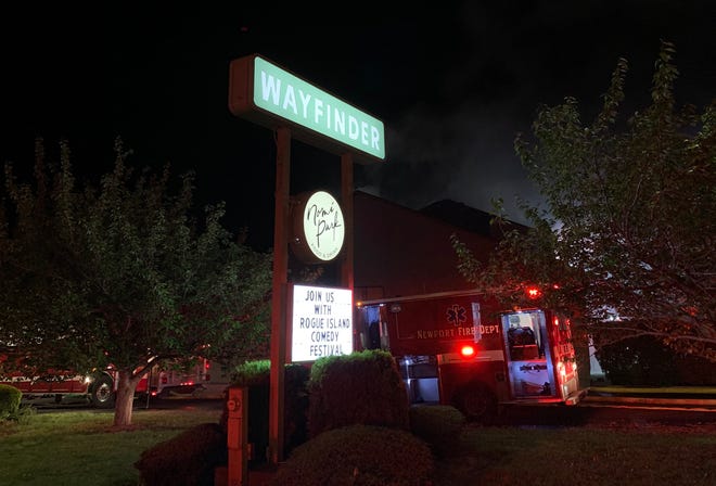 A Newport emergency vehicle is parked outside the Wayfinder Hotel, the site of a four-alarm fire on Monday, May 23, 2022.