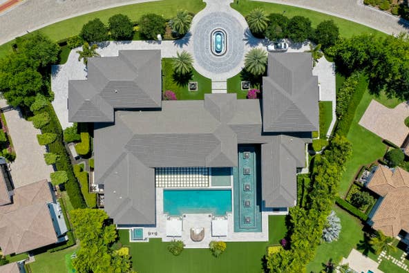 The home at 12400 Hautree Court is on the market in Palm Beach Gardens for $30 million. It was built for a collector of antiquities and includes bulletproof display cases, a secret room, a hurricane safe room with one foot of steel reinforced concrete surrounding it, $25,000 skull doorknobs and 30 doors that cost $10,000 each. Contributed by Echo Fine Propertiesault