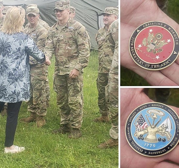 U.S. Army Secretary Christine E. Wormuth gave Cpl. Dre Hess a coin for saving a soldier who fell in a 15-foot-deep well during night land navigation at Fort Drum, N.Y.