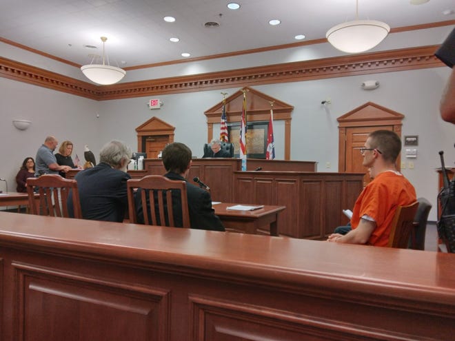 Judge Brad Hillyer conducts a preliminary hearing Wednesday for three men charged in connection with the May 15 shooting death of John Q. Bashline, II. Dalbert "Dale" Sanders, seated at right in orange, is charged with involuntary manslaughter.