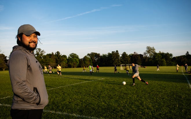 "It's really my passion. I got the city to allow us to play here, and then invested my life savings to buy these (soccer) goals," Greater Lansing Open Soccer organizer Dean Jong, 35, of Lansing says Tuesday, May 24, 2022, pictured near the soccer fields at Frances Park in Lansing. The East Lansing native started the co-ed soccer league in 2019. The league has grown to  25 teams with about 260 players