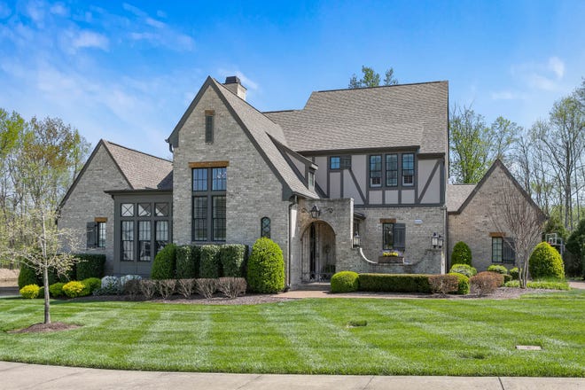 Custom built by Carbine & Associates as a Parade of Homes house, the home has five bedrooms, 4.5 baths, a private guest or in-law wing and a three-car garage.