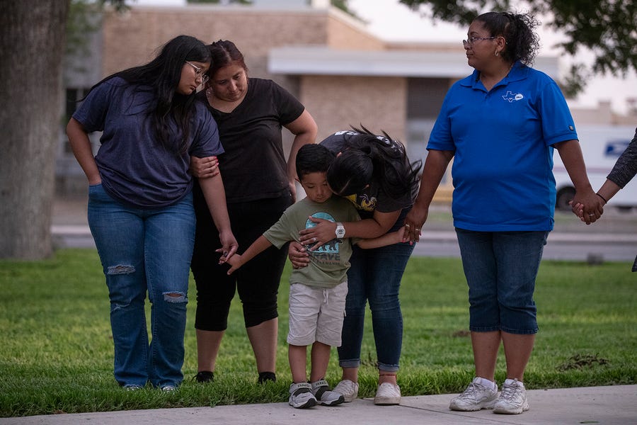 Community members gather in prayer at the Uvalde downtown plaza following the shooting at Robb Elementary School in Uvalde, Texas on Tuesday, May 24, 2022. The shooting killed 19 children and two adults. 