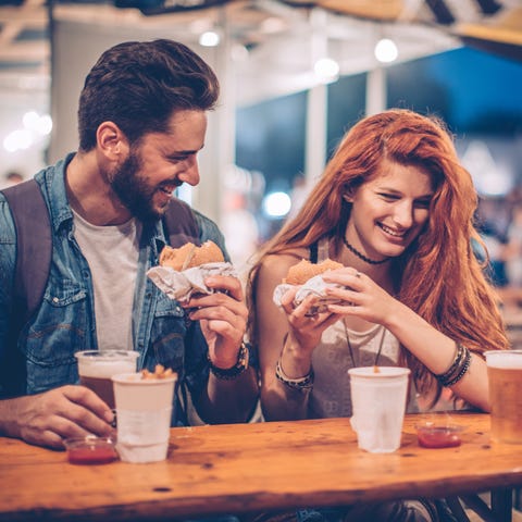 Young couple enjoying in summer music festival. We