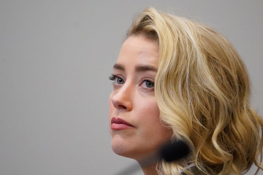 Actor Amber Heard listens in the courtroom at the Fairfax County Circuit Courthouse in Fairfax, Va., Monday, May 23, 2022. Actor Johnny Depp sued his ex-wife Amber Heard for libel in Fairfax County Circuit Court after she wrote an op-ed piece in The Washington Post in 2018 referring to herself as a "public figure representing domestic abuse." (AP Photo/Steve Helber, Pool)