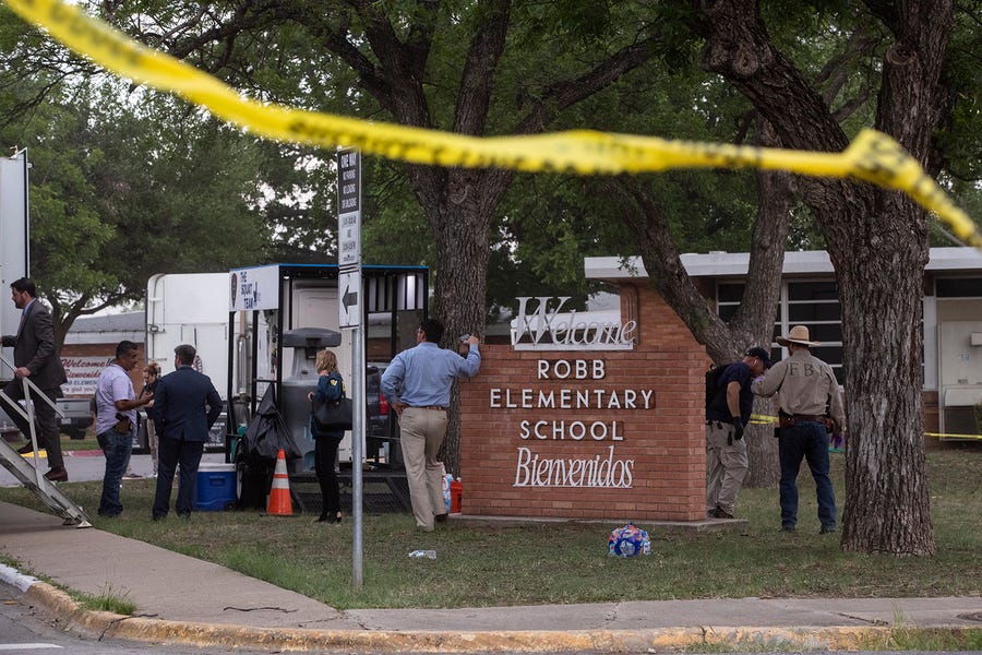 Law enforcement investigates the shooting at Robb Elementary School in Uvalde, Texas, on May 24, 2022.