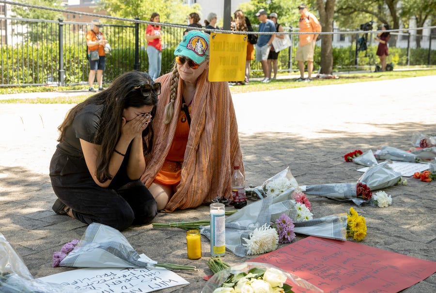 Iliana Calles cries at the Governor's Mansion during a protest organized by Moms Demand Action on Wednesday May 25, 2022, after a mass shooting at an elementary school in Uvalde. 