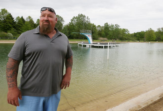 Jeremy Caudill, owner of Melanie Lake, talks about the lake in Uniontown on Wednesday.