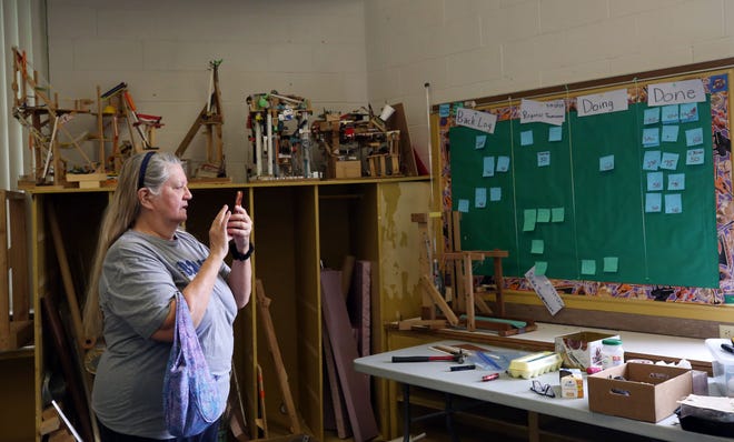Norma Wallace Secor takes photos at the Grandview Heights Schools Kindergarten Annex building on May 21 during an open house. Wallace Secor attended school in the building in 1973.