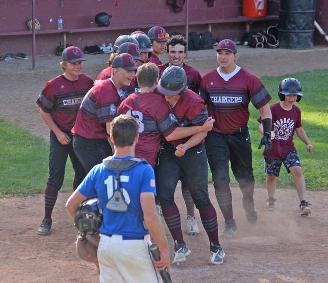 Union City's Tyler Wagley is mobbed at home after his solo home run versus Springport on Tuesday