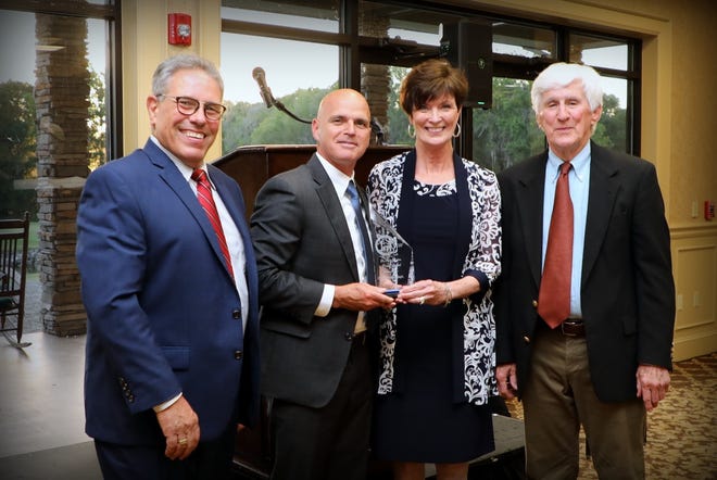 The Ocala Police Department recently received an award from the Marion County Children’s Alliance. From left: Brad Rogers, Marion County Children’s Alliance board chairman; Chief Mike Balken, Ocala Police Department; Beth McCall, executive director of the Children’s
Alliance; and Mike Jordan.