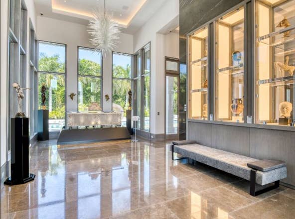 The home at 12400 Hautree Court is on the market in Palm Beach Gardens for $30 million. It was built for a collector of antiquities and includes bulletproof display cases, a secret room, a hurricane safe room with one foot of steel reinforced concrete surrounding it, $25,000 skull doorknobs and 30 doors that cost $10,000 each. Contributed by Echo Fine Properties