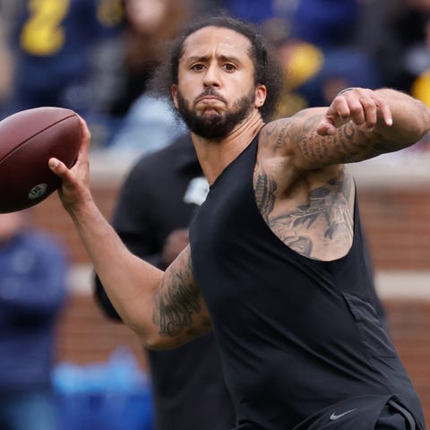 Colin Kaepernick passes during halftime at the 202