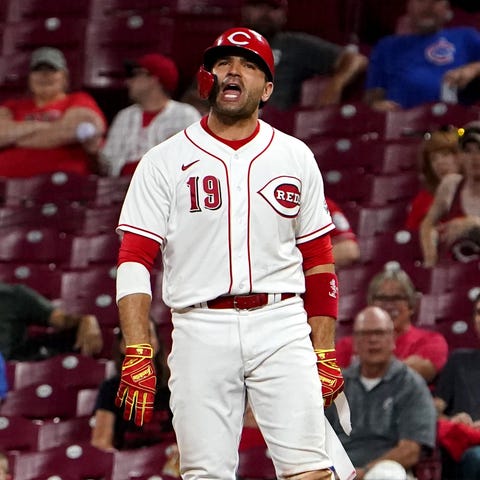 Cincinnati Reds first baseman Joey Votto argues wi
