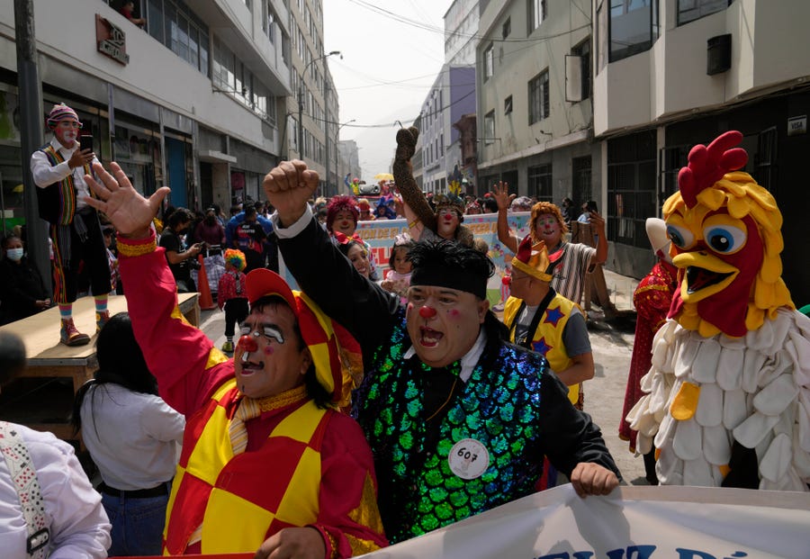Clowns march for the first time after two years of COVID-19 pandemic restrictions kept them from celebrating The Day of the Peruvian Clown, in Lima, Peru, Wednesday, May 25, 2022. (AP Photo/Martin Mejia)