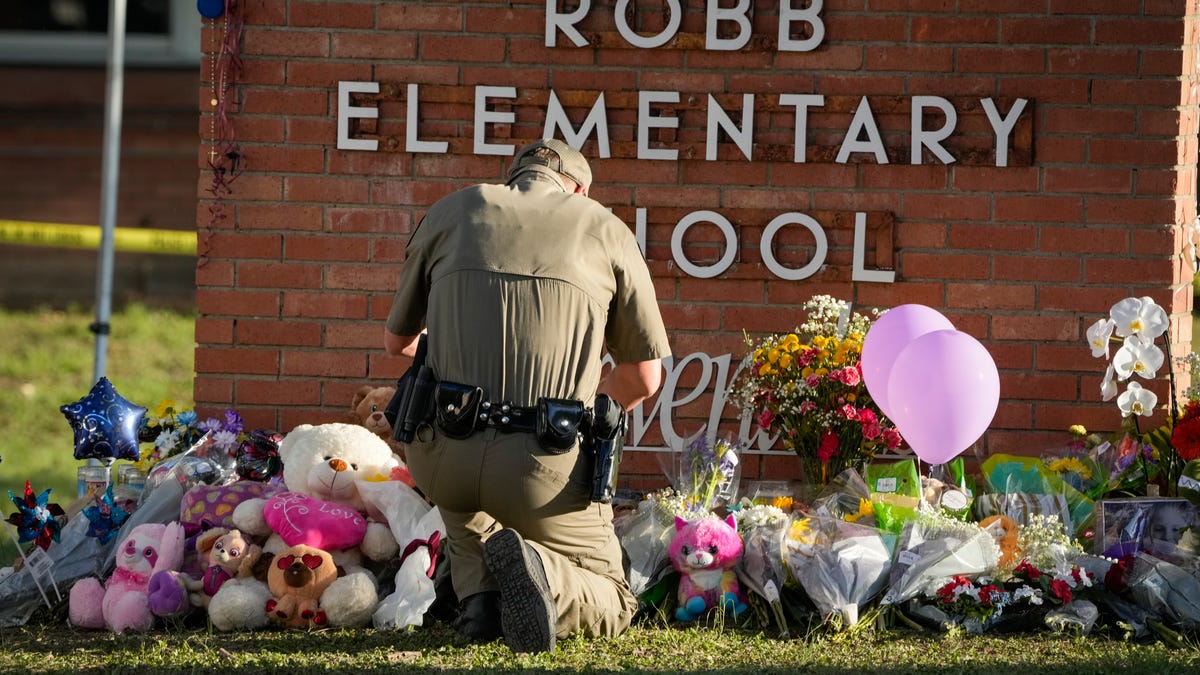 Memorial for those killed in mass shooting gets larger late in the day at the school sign of Robb Elementary School on the day after a mass shooting that left 19 children and two adults dead in Uvalde, Texas. 