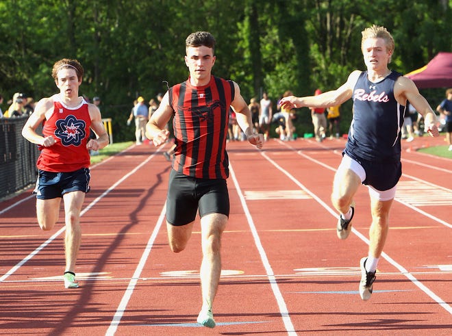 Edgewood's Zack Raake (center), competes in the 100 meter dash during the Bloomington North regional on Thursday, May 26, 2022.