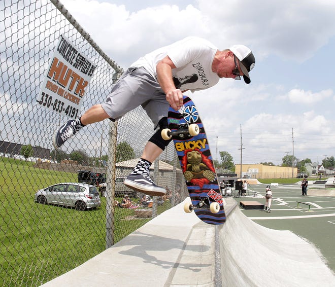Perry Township skater Jack Brooks does a "fence plant" move at Canton's 9th St. DIY skate park.