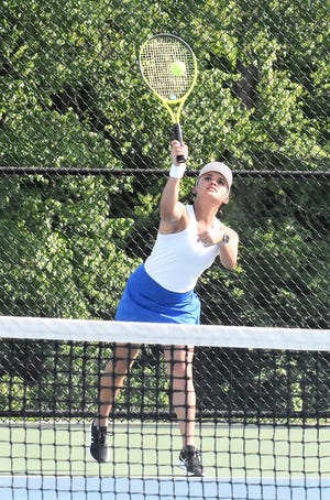 Bre Davis, part of the number one doubles team for Owen Valley, serves the ball during a recent match. Davis, along with partner Grace Coryea, advanced to the individual sectional with a win over Greencastle in the team sectional final.