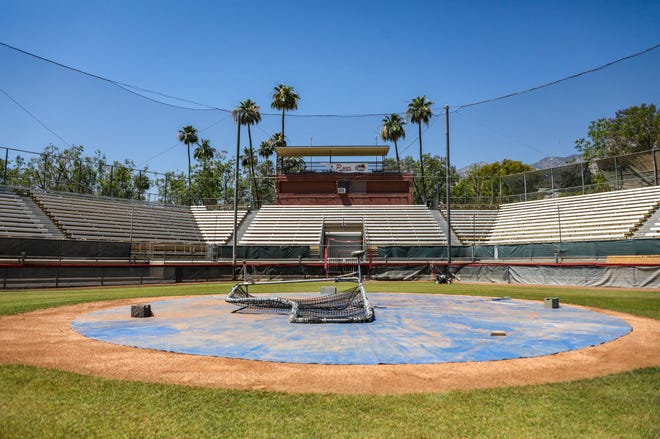 A tarp covers home plate at Palm Springs Stadium before batting practice in Palm Springs, Calif., Wednesday, May 25, 2022.
