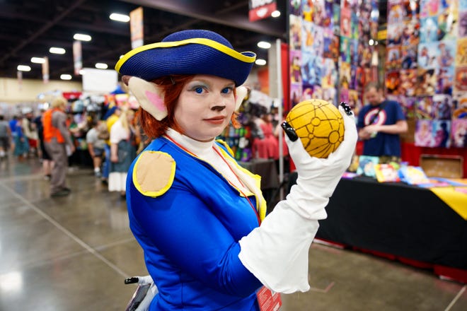Amy Munsil, dressed as Captain Amelia from Treasure Planet, poses for a photo at Fan Fusion at the Phoenix Convention Center on May 27, 2022.