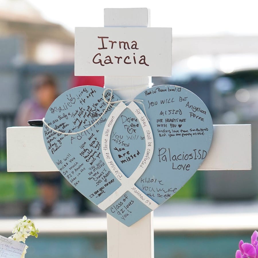 Irma Garcia - The names of shooting victims from the mass shooting at Robb Elementary School on memorial crosses in the town square in Uvalde, Texas. 