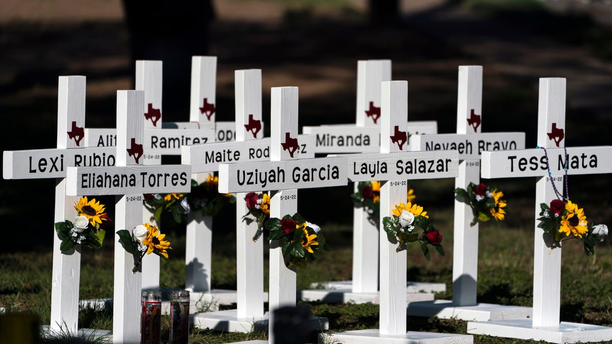 Crosses with the names of Tuesday's shooting victims are placed outside Robb Elementary School in Uvalde, Texas, Thursday, May 26, 2022. The 18-year-old man who slaughtered 19 children and two teachers in Texas left a digital trail that hinted at what was to come.