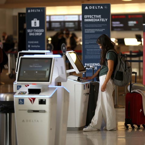 A Delta customer checks in for a flight at San Fra