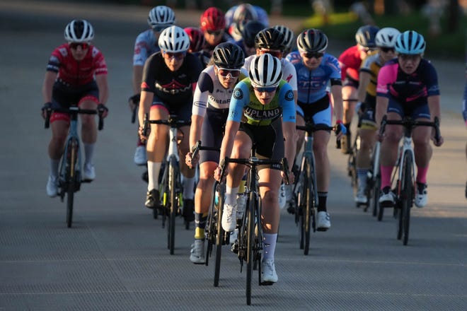 Riders during the Friday Night Fever Criterium Women's Cat 1,2 and Pro race, a brand new event that replaces the previous Burlington Road Race Friday May 27, 2022 in Burlington.  Friday Night Fever Criterium is a 14 block, 1,024 mile loop course.