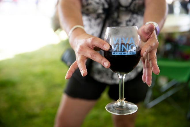 Festival-goers enjoy their drinks during the New Mexico Wine Festival at the Southern New Mexico State Fairgrounds  on Saturday, May 28, 2022. 