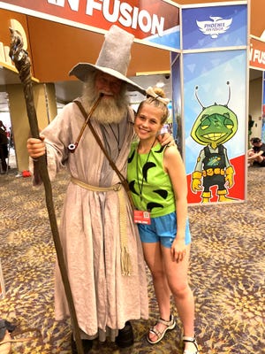 Will Friday and his daughter Tassie, 21, have been attending comic cons together for 17 years. He's been dressing as Gandalf from Lord of the Rings for nearly a decade. Photo taken May 29, 2022, at the Phoenix Convention Center.