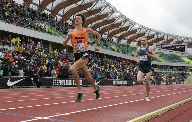 Newbury Park High's Colin Sahlman beats Olympic bronze medalist and former U.S. champion Clayton Murphy to the finish line in the Bowerman Mile at the 47th Prefontaine Classic in Oregon on Saturday.