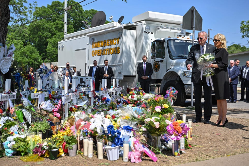 US President Joe Biden and First Lady Jill Biden pay their respects at a makeshift memorial outside of Robb Elementary School in Uvalde, Texas on May 29, 2022.
