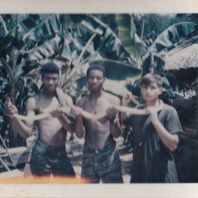 Paul Infante, right, with two unidentified Marines during the Vietnam War.