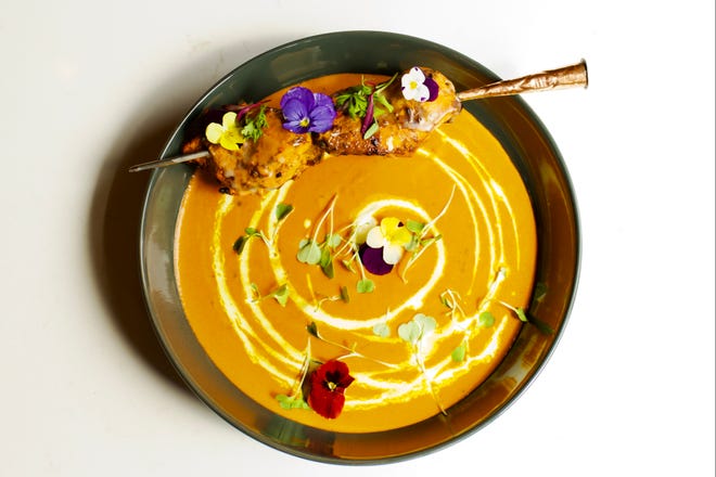 Plating is modern at Saffron, as in this menu item, Saffron butter chicken.