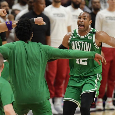 Boston Celtics players celebrate after defeating t