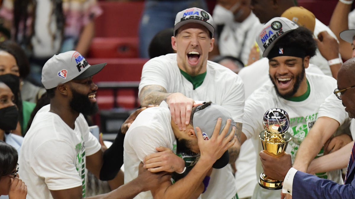 Boston Celtics forward Jayson Tatum (0) and teammates react after Tatum won the Larry Bird Eastern Conference Finals MVP trophy.