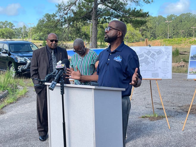 Augusta mayoral candidate and former Richmond County Tax Commissioner Steven Kendrick (right) announced plans for a new development on the former Regency Mall site, on May 31, 2022. Standing behind him are Augusta Commissioners Dennis Williams (from left) Francine Scott and, obscured by Kendrick, Bobby Williams.