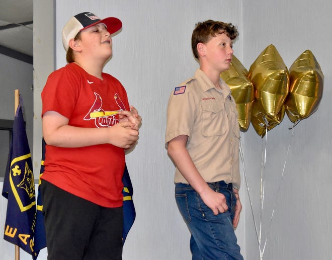 Preston Wood, left, and Jace Lerminez receive the Arrow of Light Award during Orion Cub Scout Pack 123’s Blue and Gold banquet on Sunday, May 1, in the Methodist Activity Center. Also advancing are Wyatt Butler, Walker Mason, Sam Mortenson and Collin Patterson.