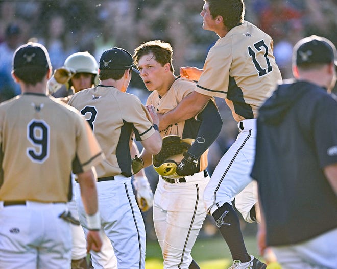New Prairie’s Mason Braun (center) celebrates after a two-run homer in the bottom of the 3rd inning of the class 3A sectional championship Monday, May 30, 2022, at Clay High School.