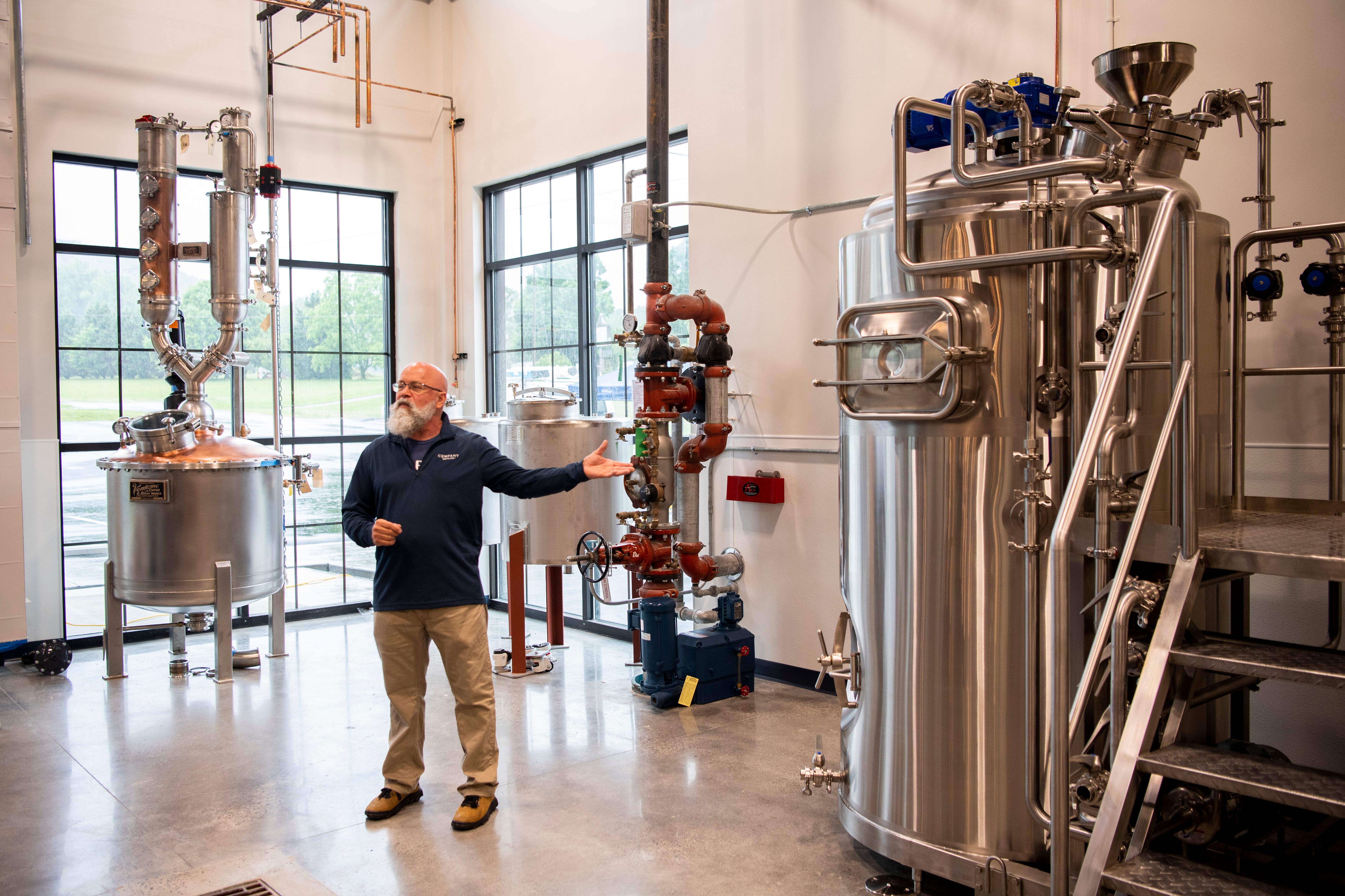 Company Distilling's director of production processing Kevin Smith gives a tour of the production area of the distillery's Townsend location on Monday, May 23, 2022.