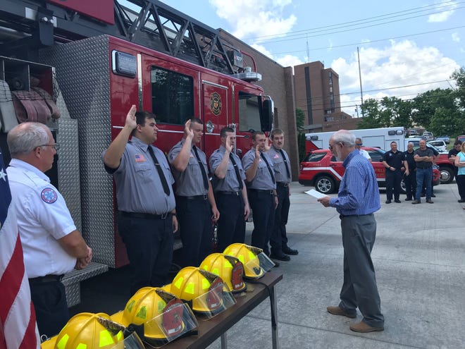Interim Mansfield Safety-Service Director Dave Remy swears in five new firefighters Tuesday outside Station 1, 140 E. Third St. Left to right are Patrick Ryan, Michael Garn, Mitchell Perry, Elijah Thomas and Isaiah Adams. At far left is Chief Steve Strickling.