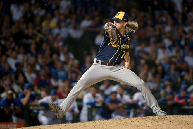 Milwaukee Brewers relief pitcher Josh Hader throws during the ninth inning against the Chicago Cubs in the second game of a baseball doubleheader, Monday, May 30, 2022, at Wrigley Field in Chicago. (AP Photo/Mark Black)