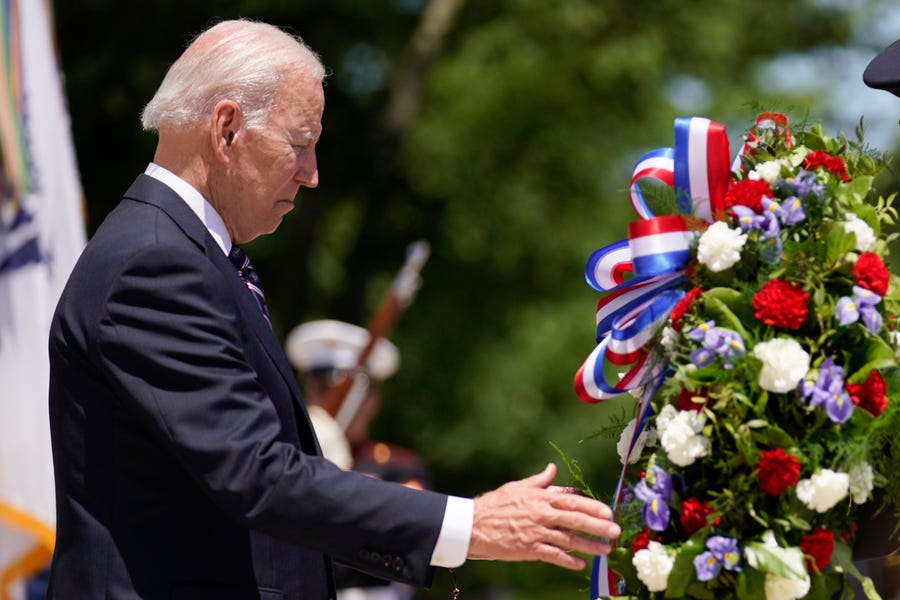 President Joe Biden lays a wreath at The Tomb of the Unknown Soldier at Arlington National Cemetery on Memorial Day, Monday, May 30, 2022, in Arlington, Virginia.