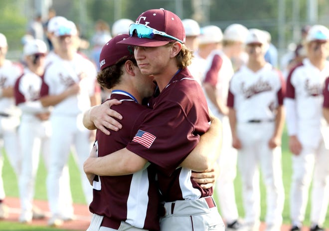 Canal Winchester's Jack Sprague embraces teammate John Romig following a 2-1 loss to New Albany in a Division I district final May 25 at Grove City. The Indians went 20-6 overall and won the OCC-Capital title at 14-0.