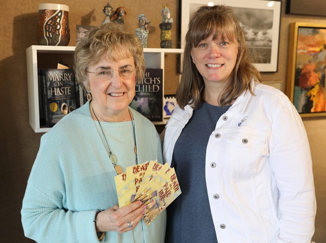 Monmouth author Susan Van Kirk (left) posed next to Kristyne Gilbert, executive director of the Buchanan Center in Monmouth.